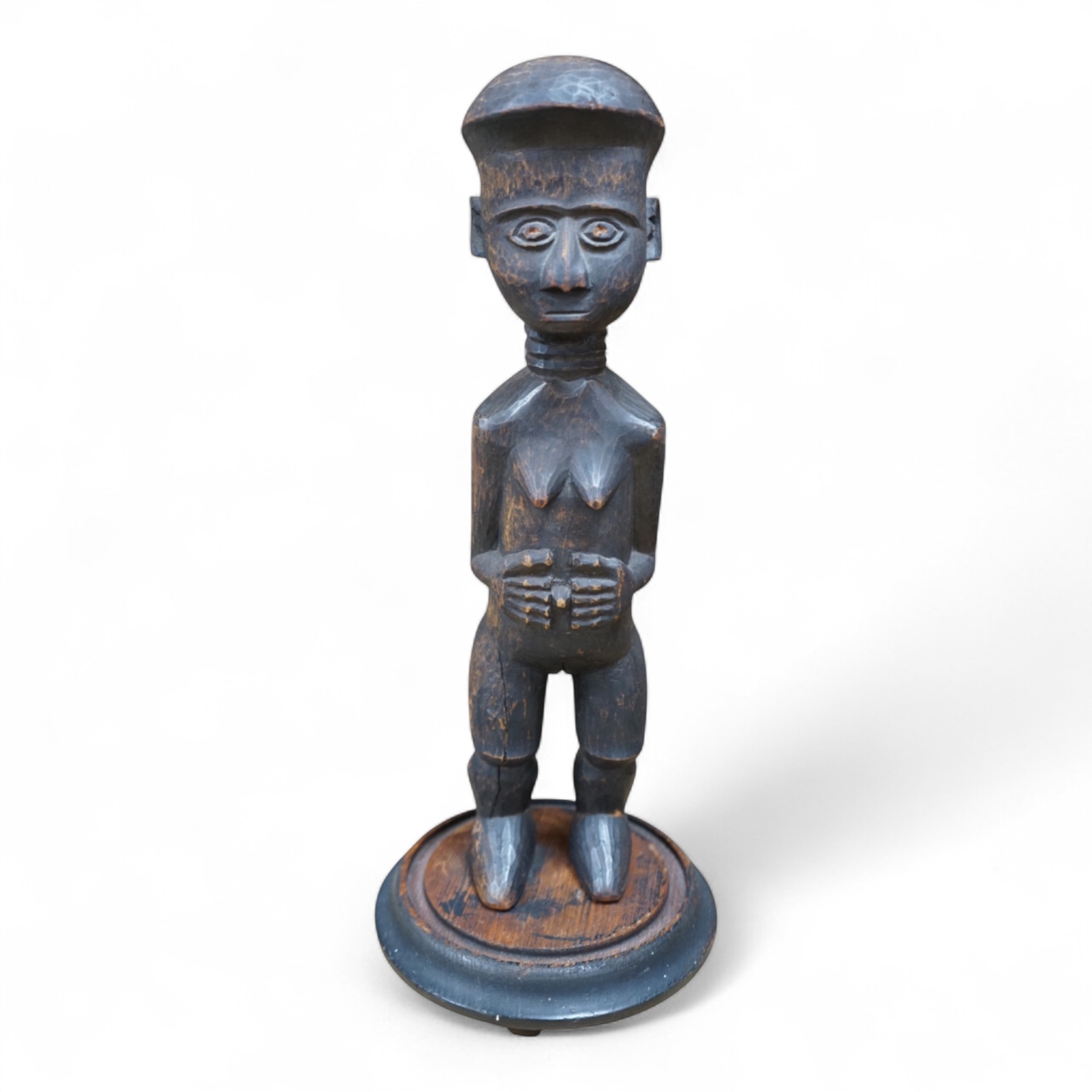 A Fang peoples female reliquary figure, Equatorial Guinea, Provenance - vendors grandfather in law brought back from Africa when working in the Gold Coast late 19th/early 20th century, on stand, 36cm high not including s